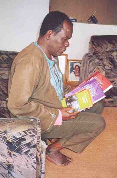 Christian worker in Nigeria receiving his Christian Worker's Kit of books