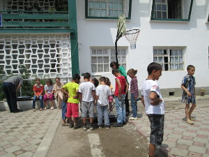 orphans hanging out in courtyard