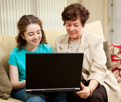 a mother and daughter shopping together online